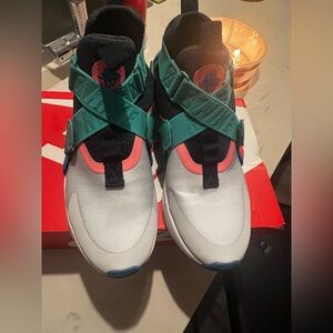 Nike   huarache city teal , blue , pink sneakers .